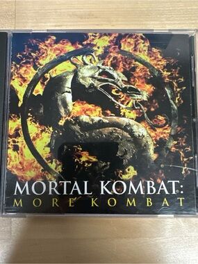 Source Unknown Mortal Kombat CD — Black, Yellow, Orange